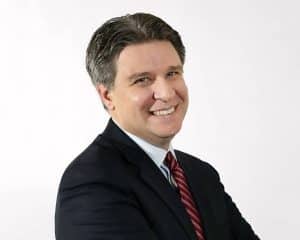 A headshot of psychologist Andrew Cleek, who serves as the deputy executive director at the McSilver Institute for Poverty Policy and Research at New York University.