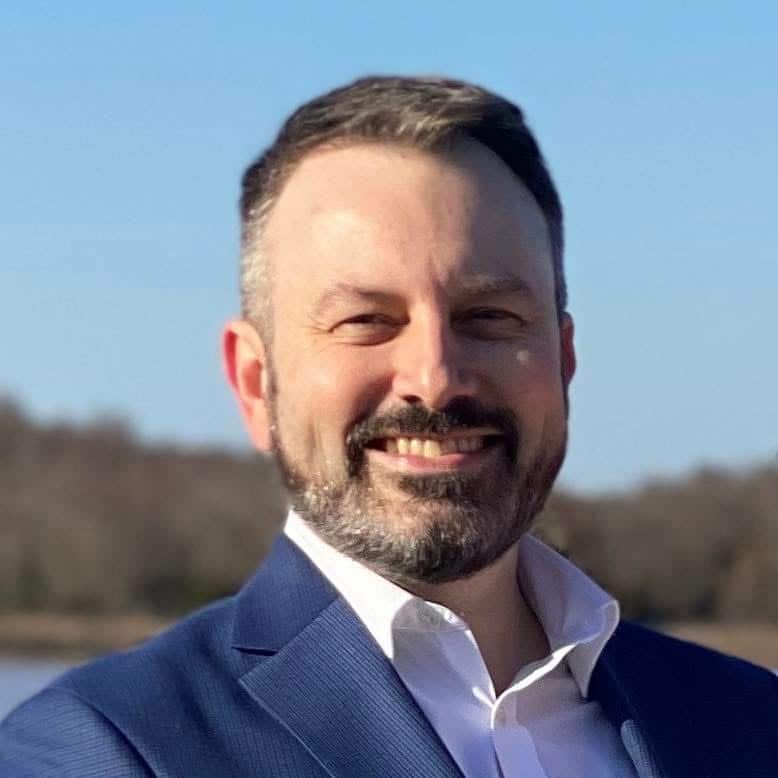 Nathan Billy, SAMHSA's former Region 10 director smiles in a suit jacket outside