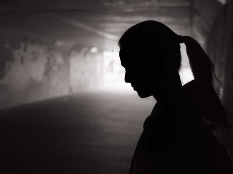 Silhouette of woman in a tunnel