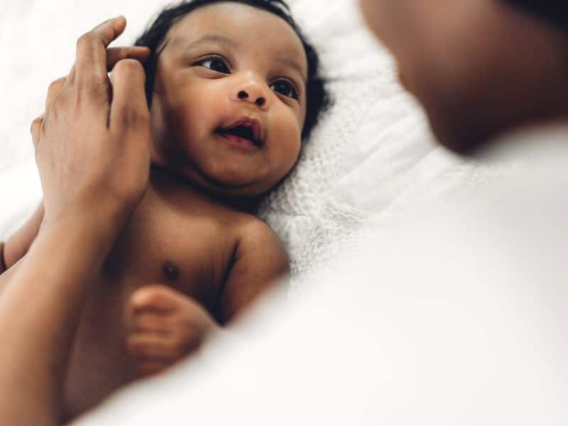 African American baby looking intently at mother